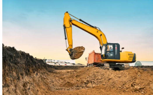 An Image Illustrating A Large Yellow Construction Excavator At A Quarry Construction Site, Highlighting The Potential Concerns Associated With Land Grabbing